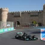 A Mercedes F1 car races alone around the Baku Street Circuit in 2021.