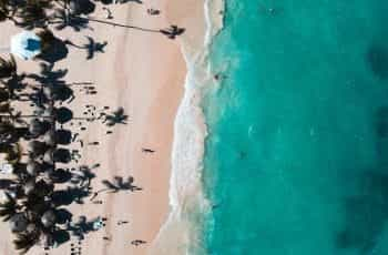 Aerial shot of the clear blue ocean beaches of Punta Cana.