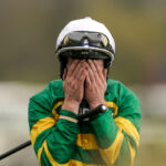 Paul Townend covers his face after riding I Am Maximus to Grand National victory.